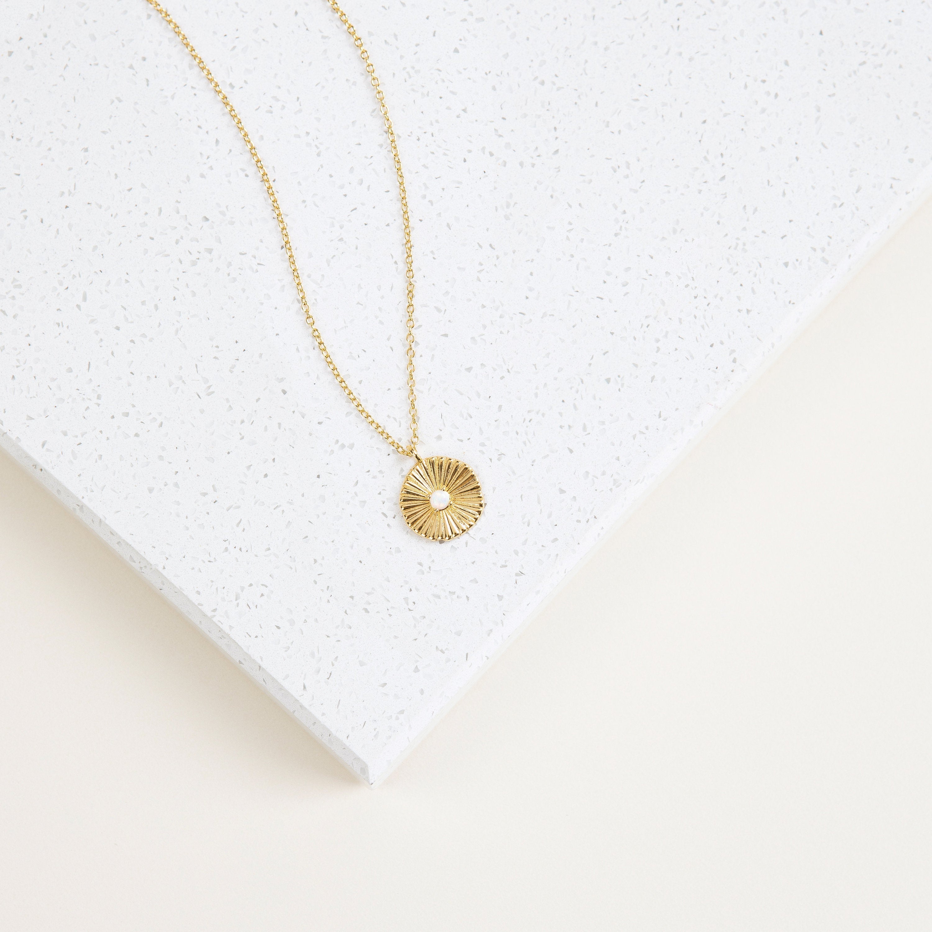 Delicate Nova pendant on chain.